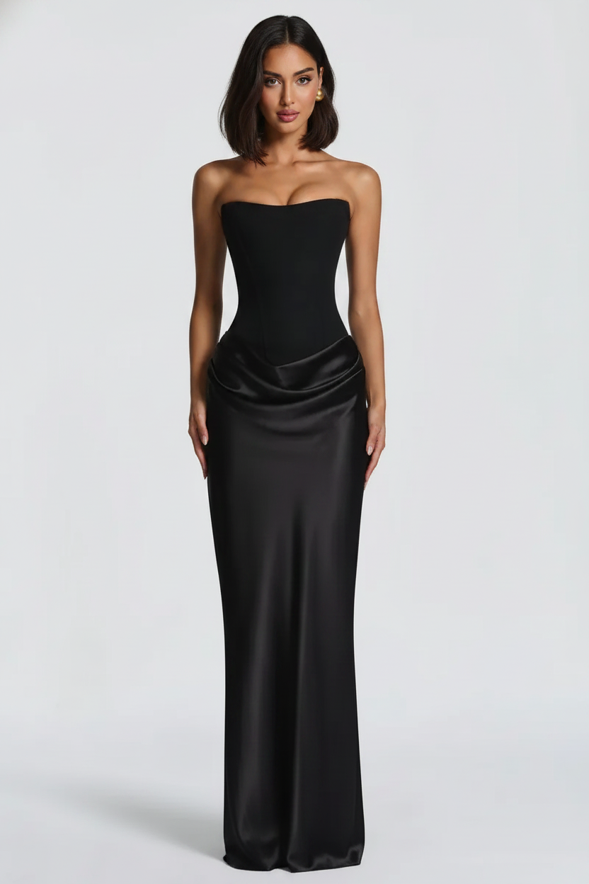 Woman wearing a black strapless gown on a white background