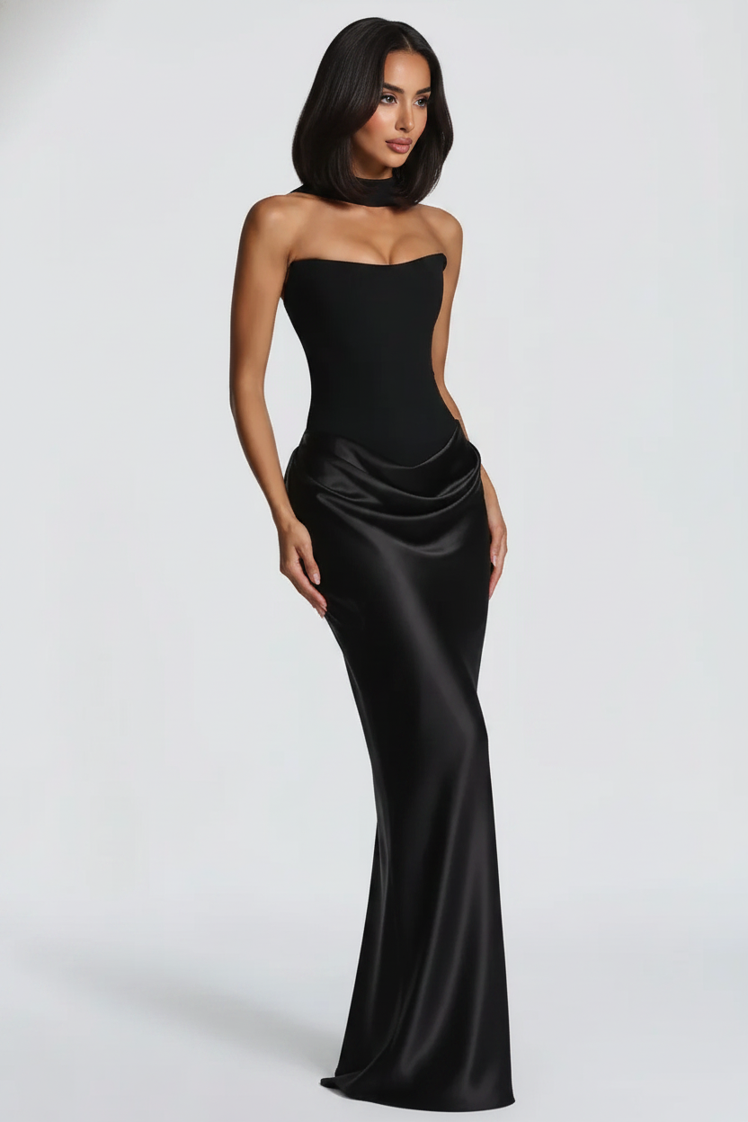 Woman wearing a black strapless gown on a white background