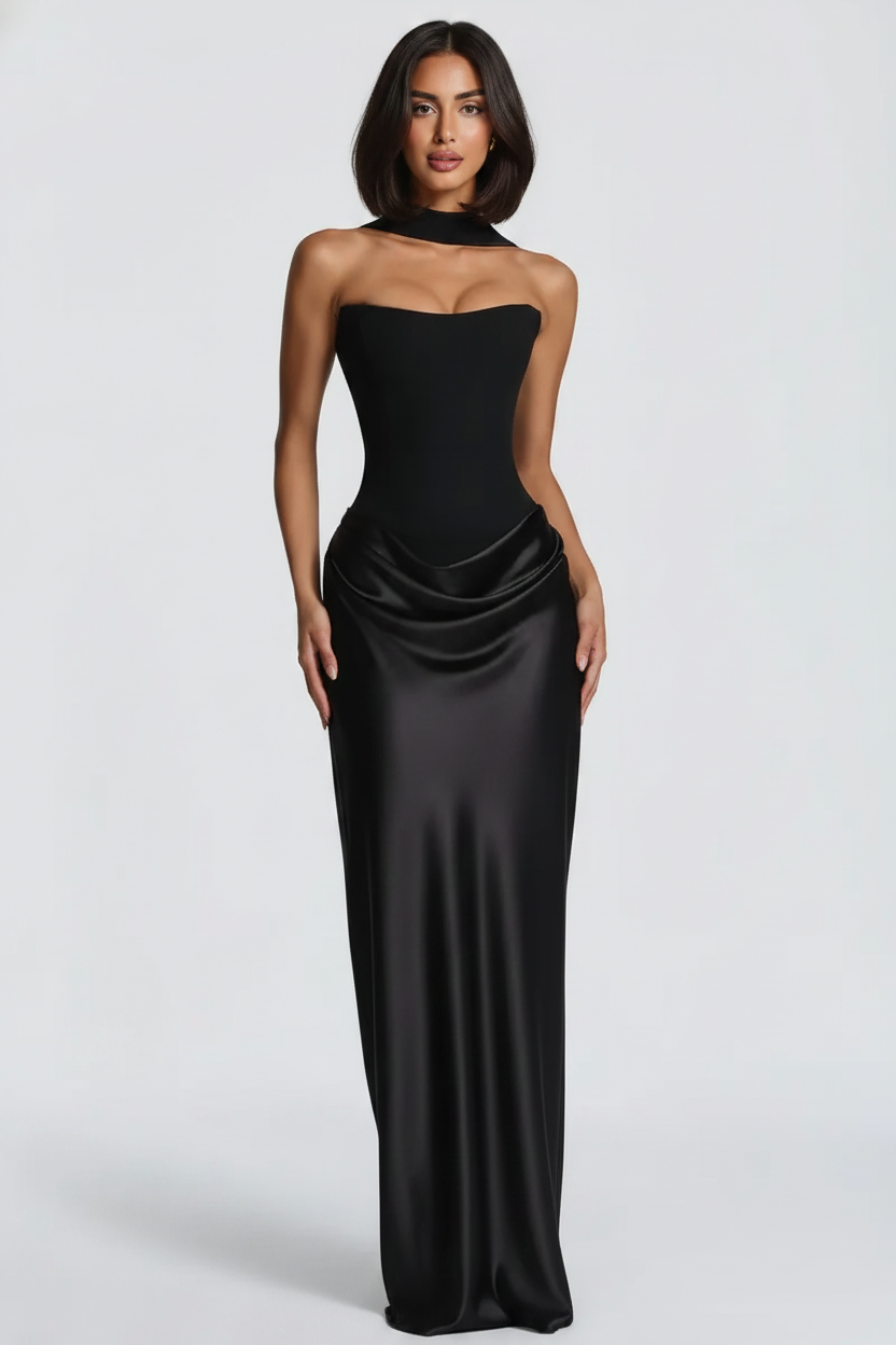 Woman wearing a black strapless gown on a white background