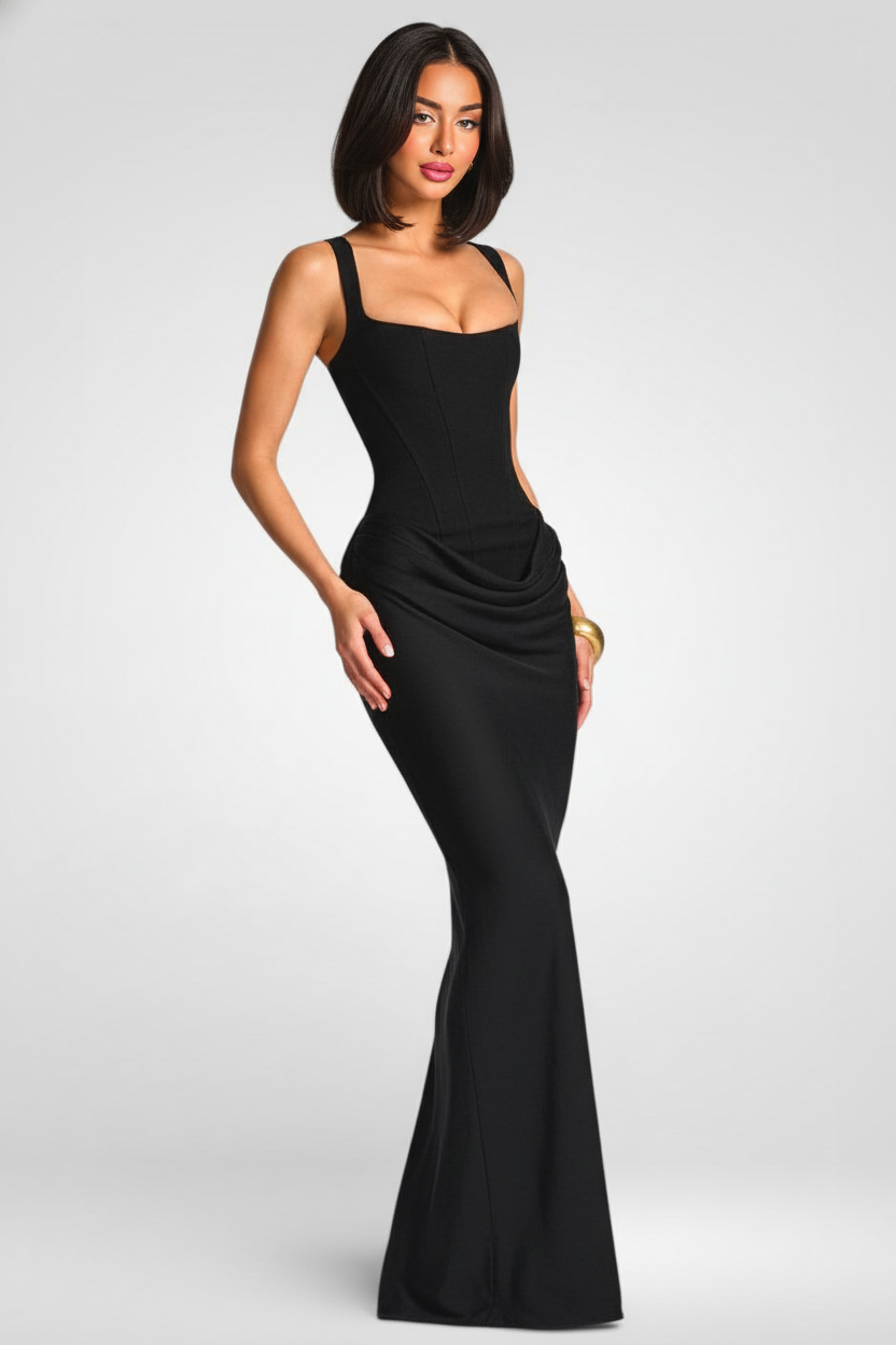 Woman wearing a black evening gown on a white background