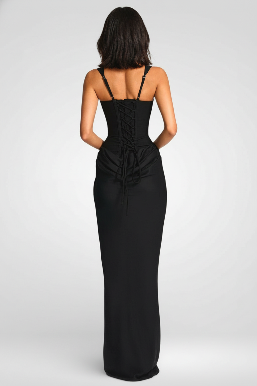 Black evening gown with open back on a white background
