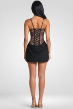 Black lace dress with a white background