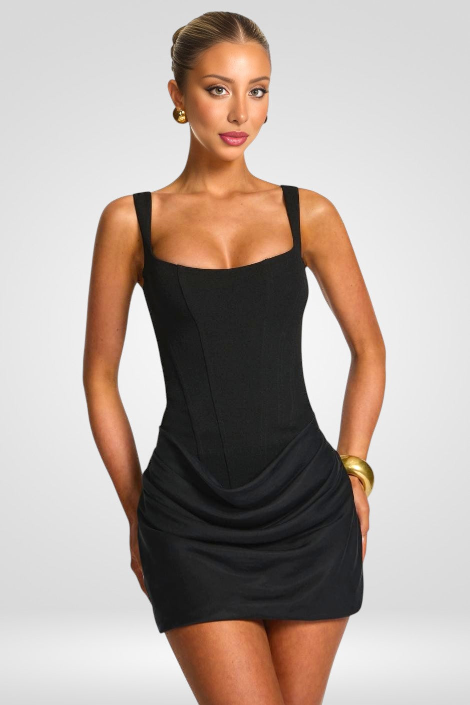 Woman wearing a black dress on a white background