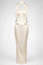 A cream-colored satin dress with a halter neckline and a matching waist belt, displayed on a neutral light gray background.