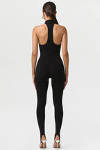 Black jumpsuit worn by a model on a white background