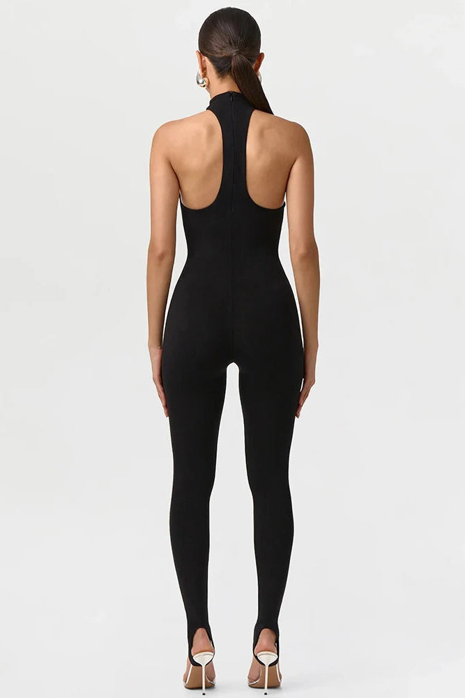 Black jumpsuit worn by a model on a white background