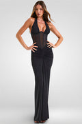 Woman wearing a black evening gown on a white background
