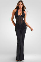 Woman wearing a black evening gown on a white background