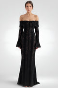 Black off-shoulder dress with floral lace details on a white background