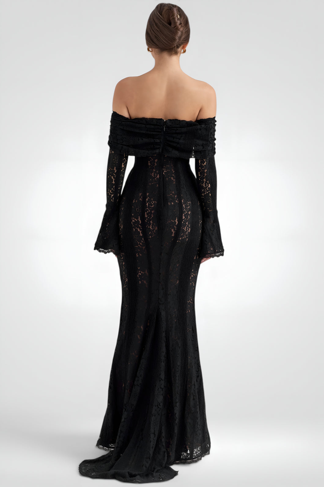 Black off-shoulder evening gown with intricate detailing on a white background