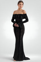 Black off-shoulder evening gown on a white background