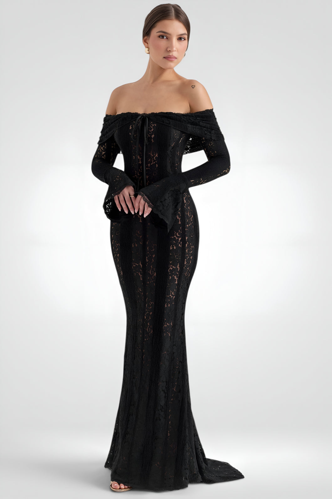 Black off-shoulder evening gown on a white background