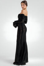 Black off-shoulder evening gown with lace details on a white background