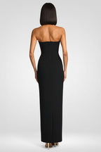 Black strapless gown on a white background