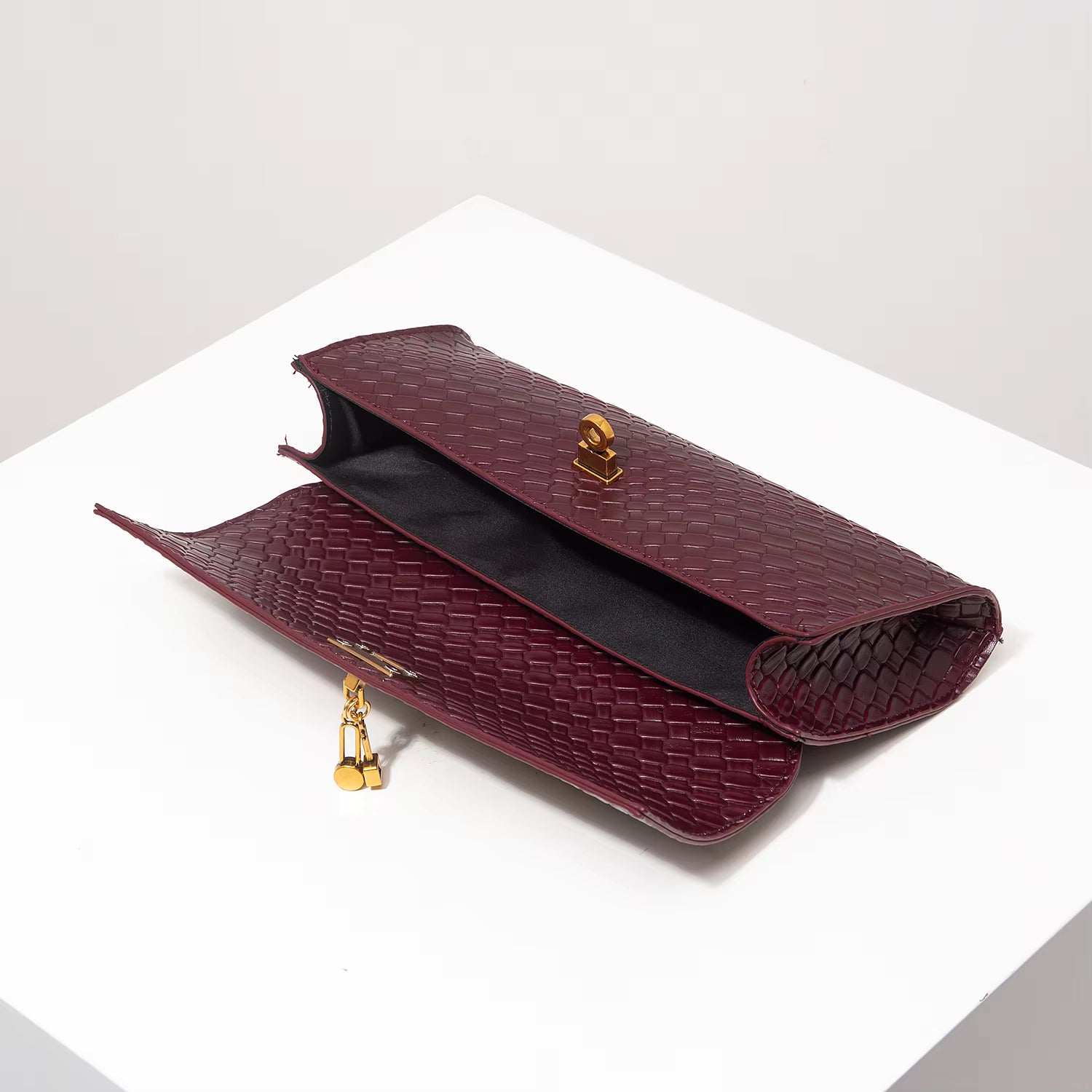Woven Burgundy Baguette Clutch with Gold Lock