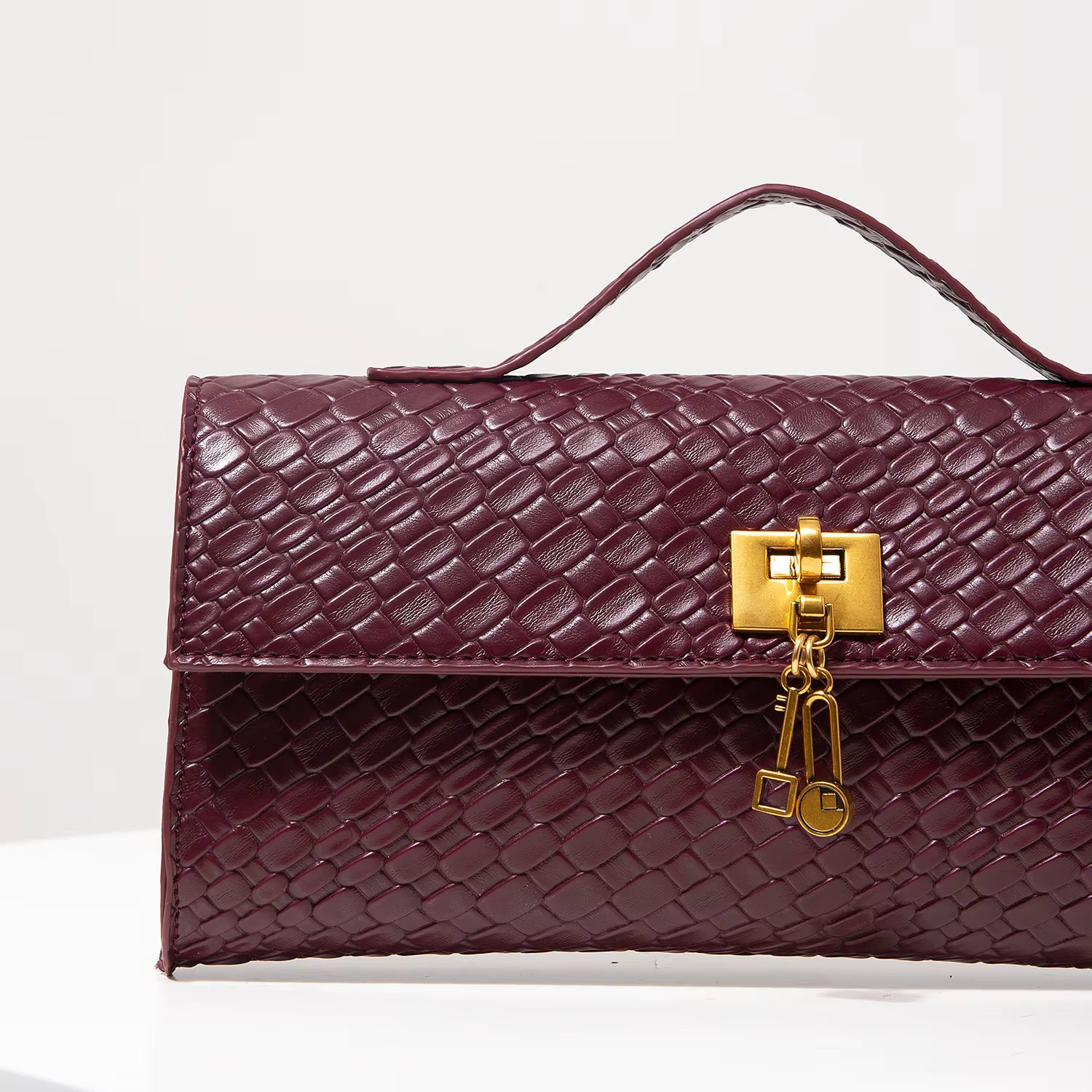 Woven Burgundy Baguette Clutch with Gold Lock