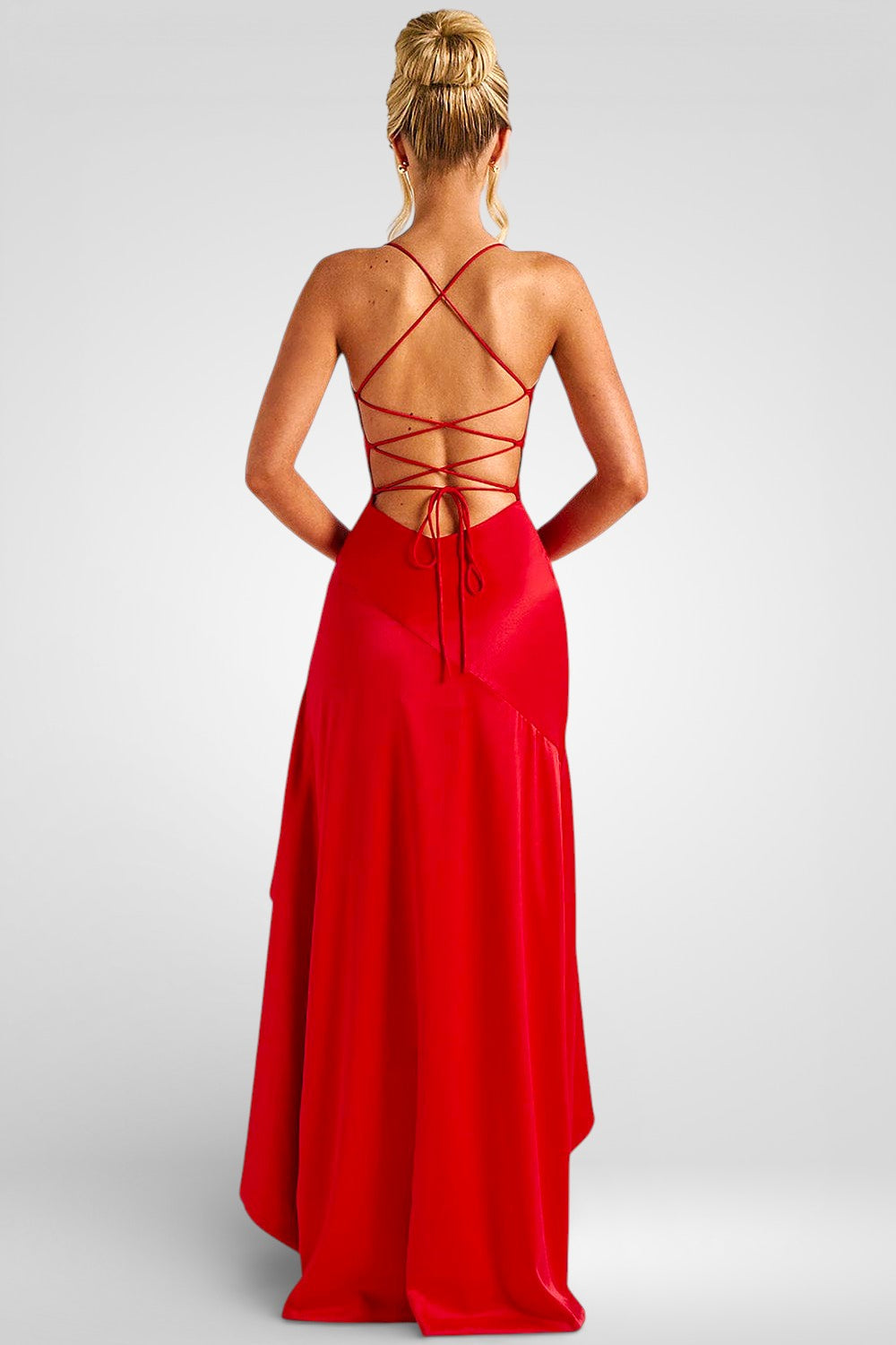 Red evening gown with strappy back on a plain background