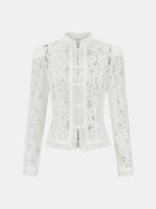 White lace blouse on a light gray background