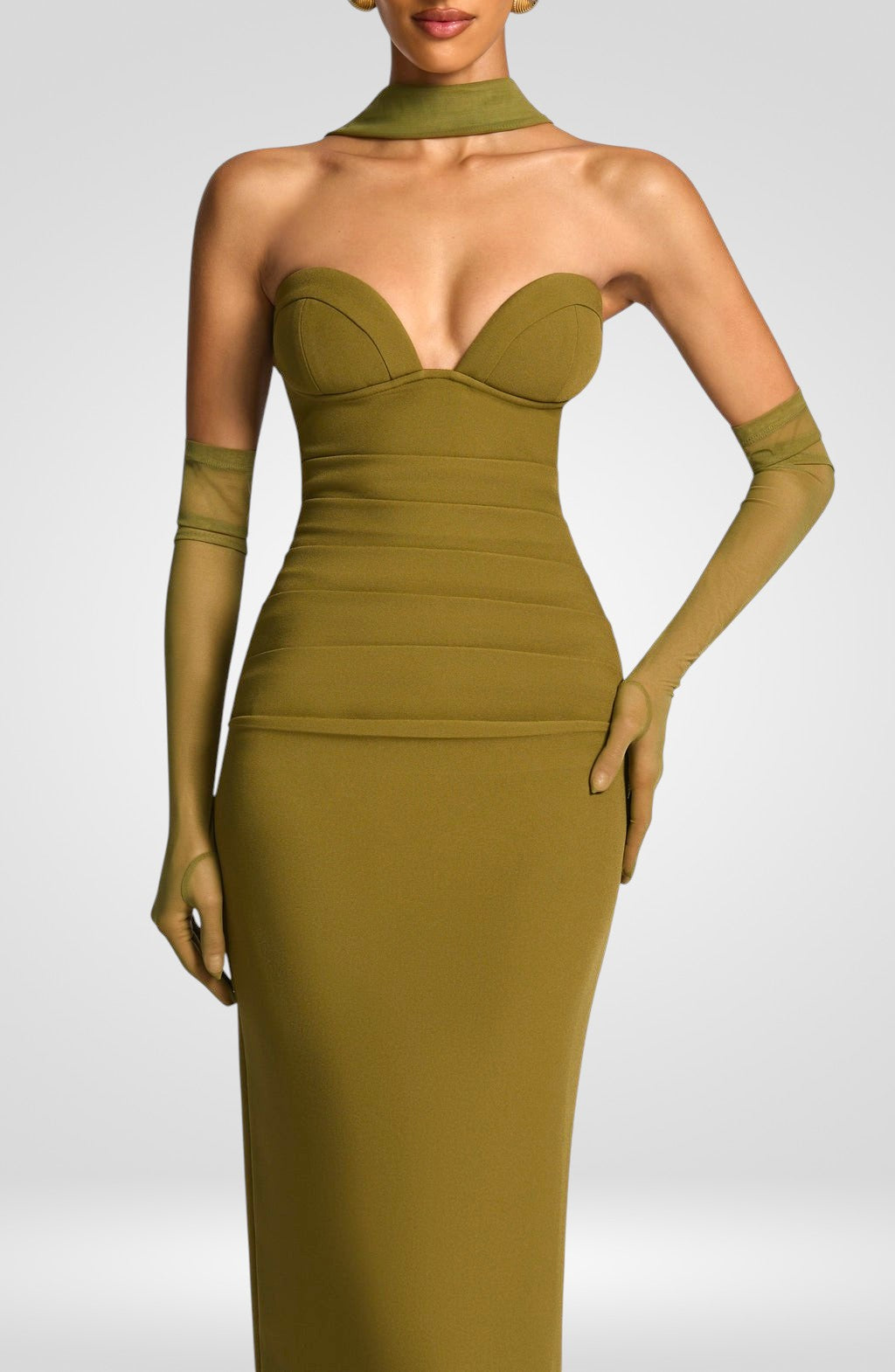 Green evening gown with matching gloves on a white background