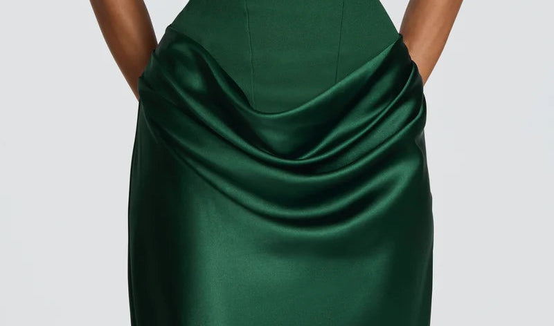 Green strapless dress on a plain background